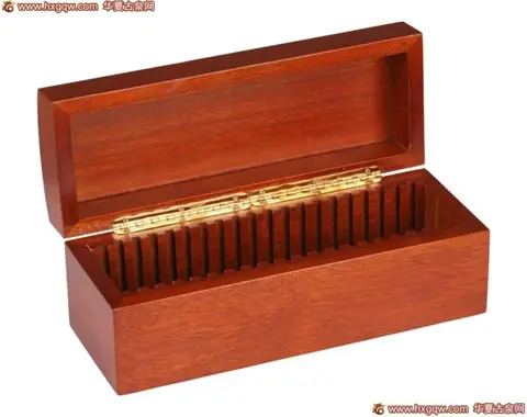 Rectangular wooden commemorative coin packaging box with hinged lid and gold-toned metal hinge, finished in warm reddish-brown stain