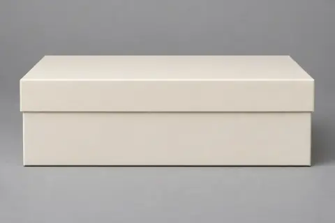 Front view of a closed cream two-piece rigid box with clean edges and matte surface